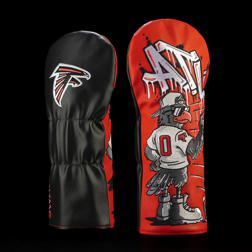 SWAG Golf NFL Atlanta Falcons Beware Of Birds Driver Cover with a graffiti artist wearing a Falcons jersey and spray-painting ATL on a brick wall.