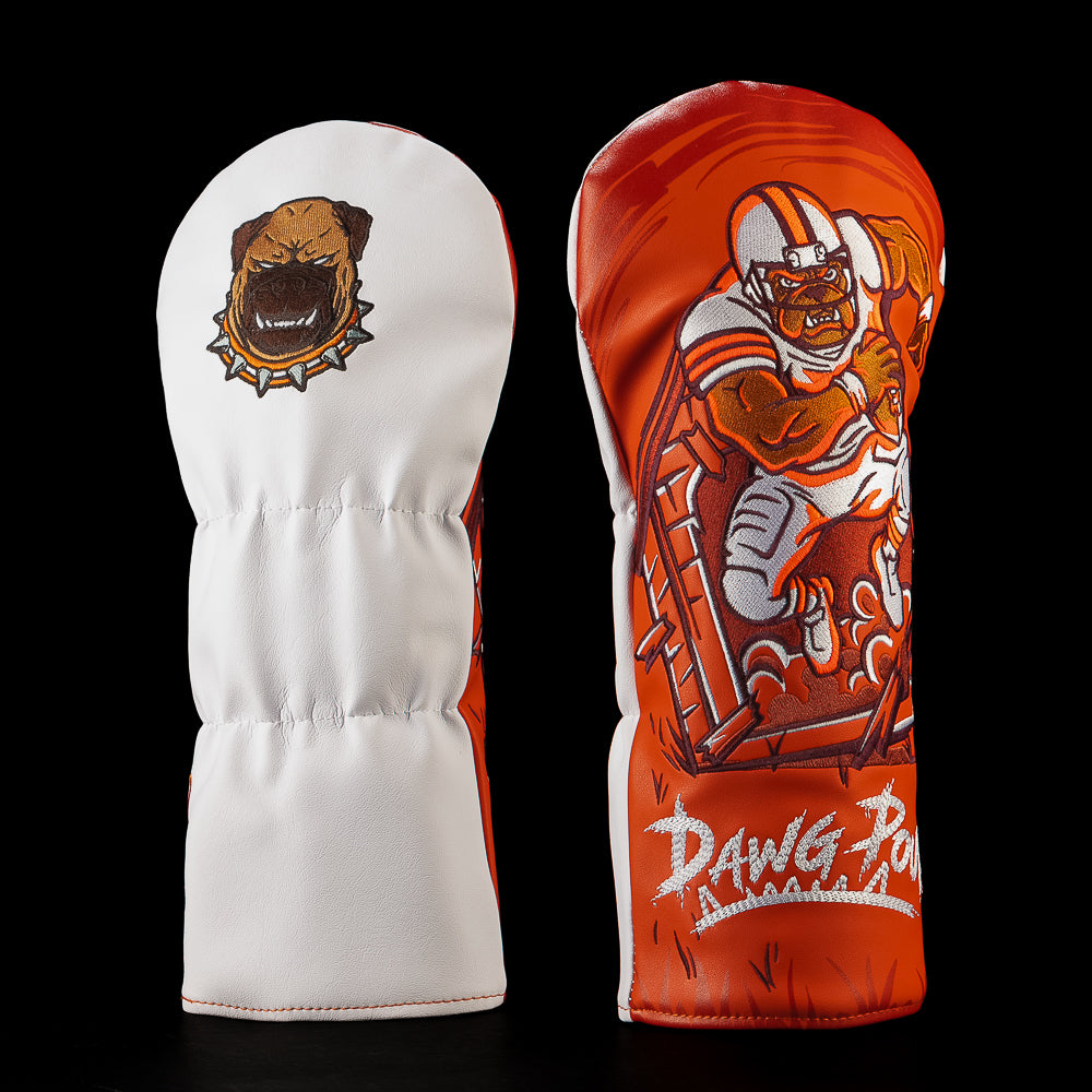 SWAG Golf NFL Cleveland Browns Chomps Driver Cover with a helmeted football player crashing through a wooden fence above Dawg Pound lettering.