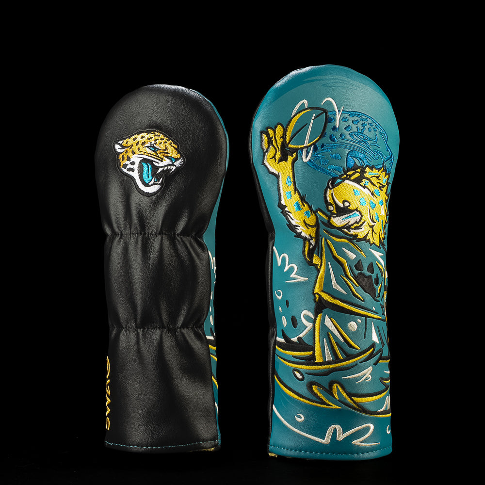 SWAG Golf NFL Jacksonville Jaguars There Goes Jackson Fairway Cover with a jaguar mascot catching a football while riding through teal waves.