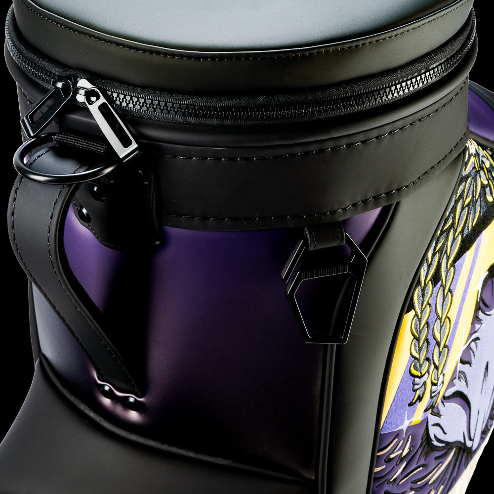 Close-up of the SWAG Golf Baltimore Ravens Den Caddy Cooler showing premium zipper hardware, black leather construction, and purple fade side panels.