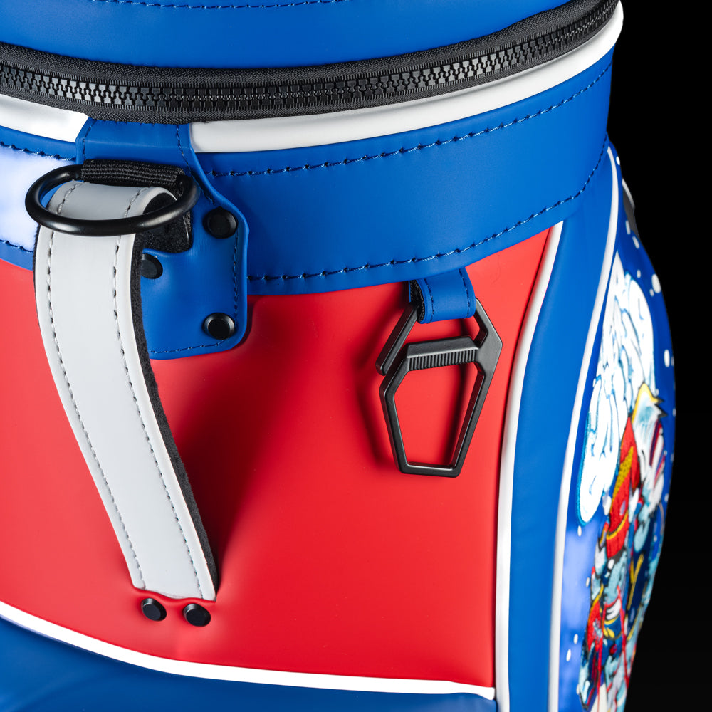 Close-up of the Buffalo Bills Den Caddy Cooler zipper, handle, and red, white, and blue panels.