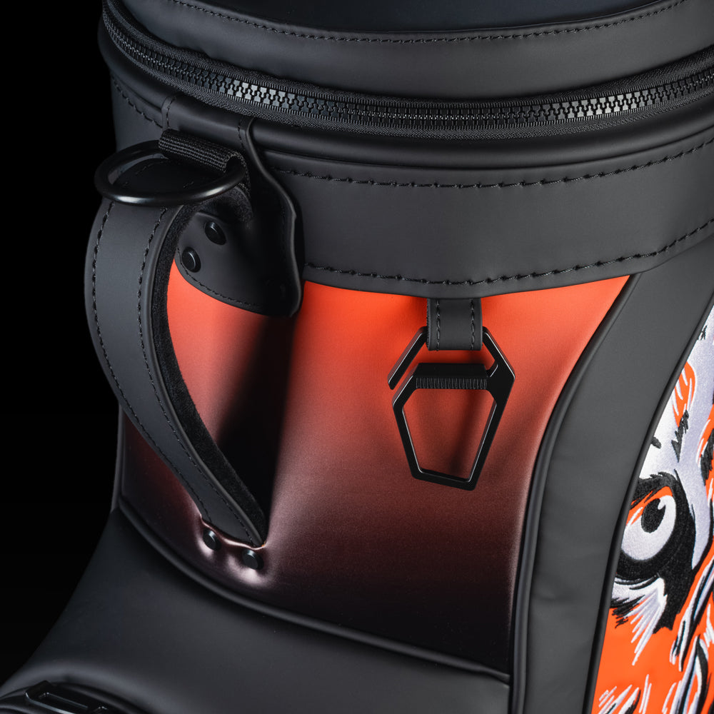 Close-up of the Cincinnati Bengals Den Caddy Cooler zipper, handle, and orange and black panels.