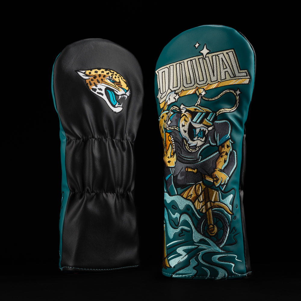 Jacksonville Jaguars driver cover with jaguar riding a bike through water and caption “duuuval”