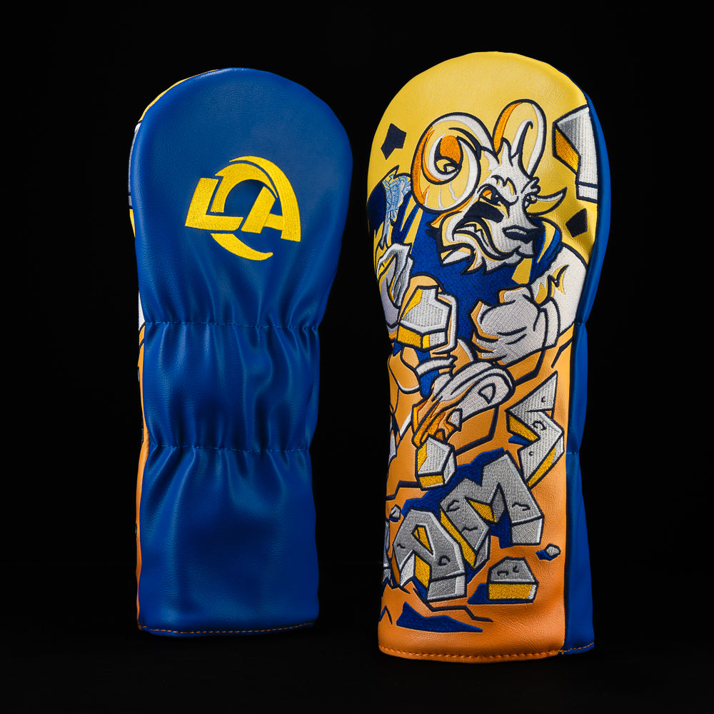 LA Rams driver cover with a ram running with crushed pavement and the word “Rams” in crushed pavement.