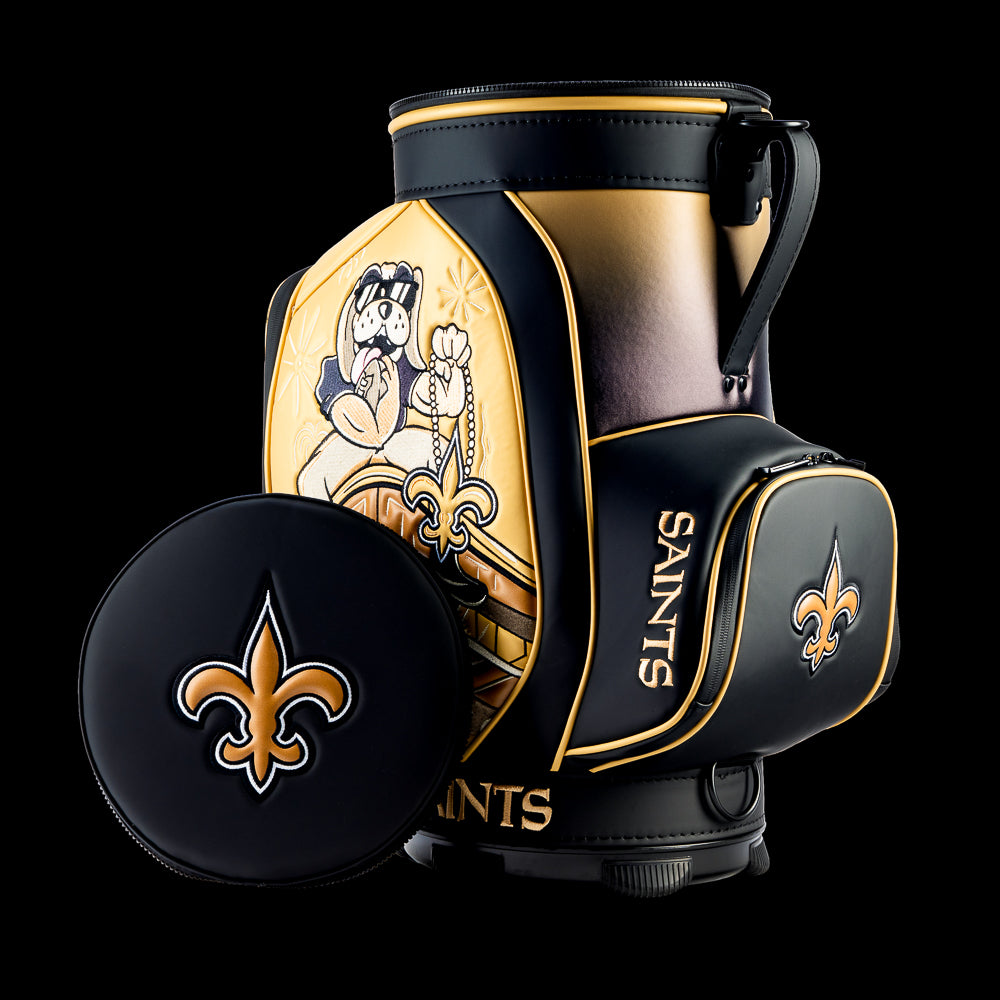 New Orleans Saints Den Caddy Cooler displayed with the removable embroidered lid beside the cooler.