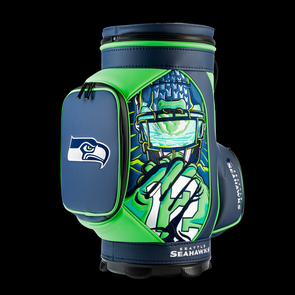 SWAG Golf Seattle Seahawks Den Caddy Cooler featuring futuristic Seahawks fan artwork, navy, action green, and gray graphics, and an embroidered Seahawks logo pocket.