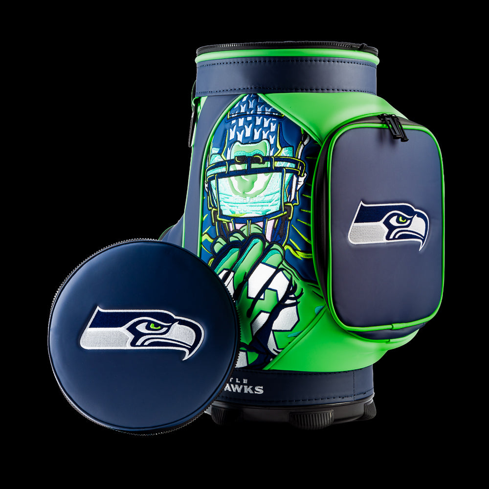 Seattle Seahawks Den Caddy Cooler displayed with the removable embroidered lid beside the cooler.