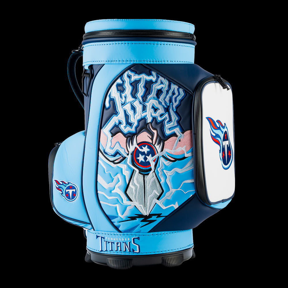 SWAG Golf Tennessee Titans Den Caddy Cooler featuring sword and lightning artwork, navy and Titans blue graphics, and an embroidered Titans logo pocket.