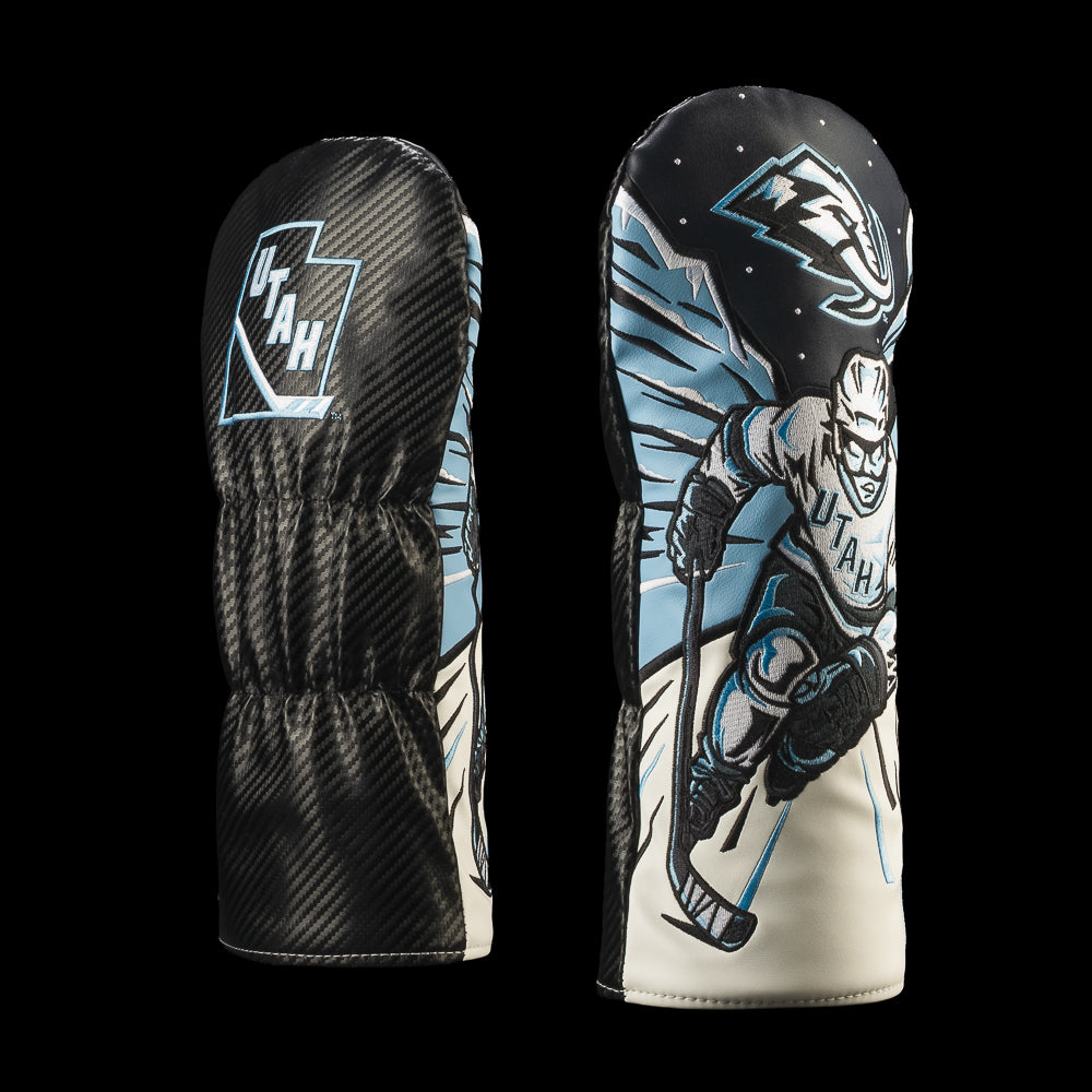 Black Utah Mammoth driver cover with icy blue accents and a white mammoth hockey player charging forward with a stick and Utah Mammoth logo.