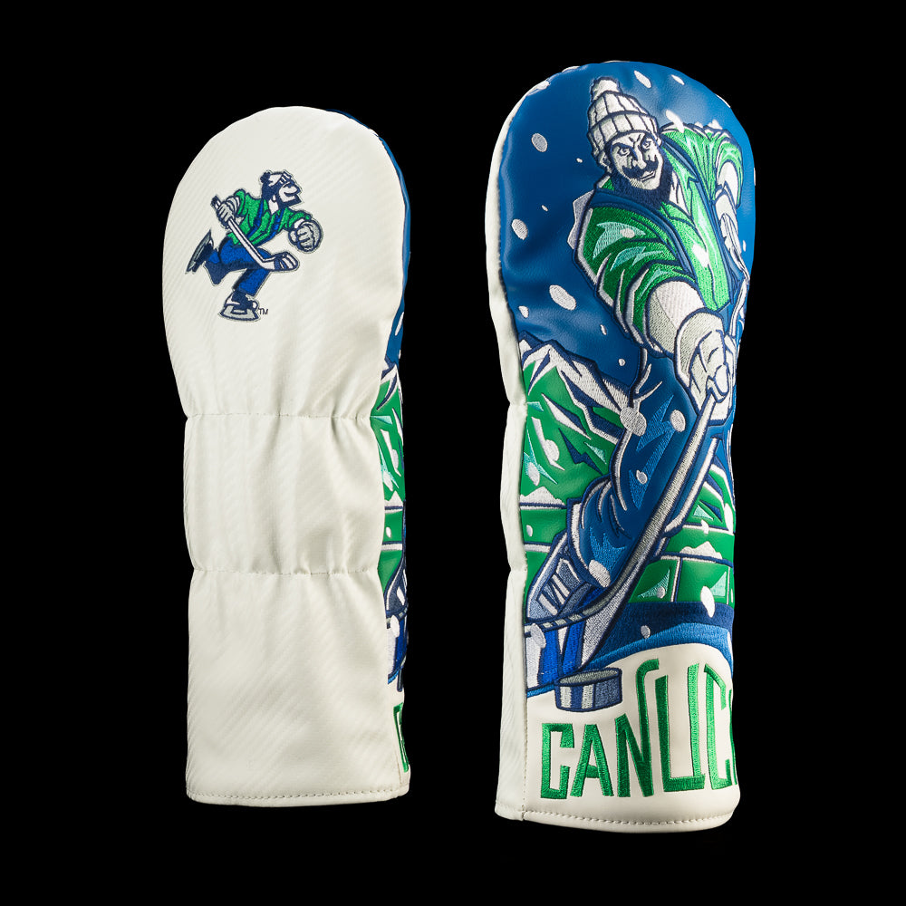 White Vancouver Canucks driver cover with blue-and-green hockey player artwork, falling snow and bold Canucks lettering.