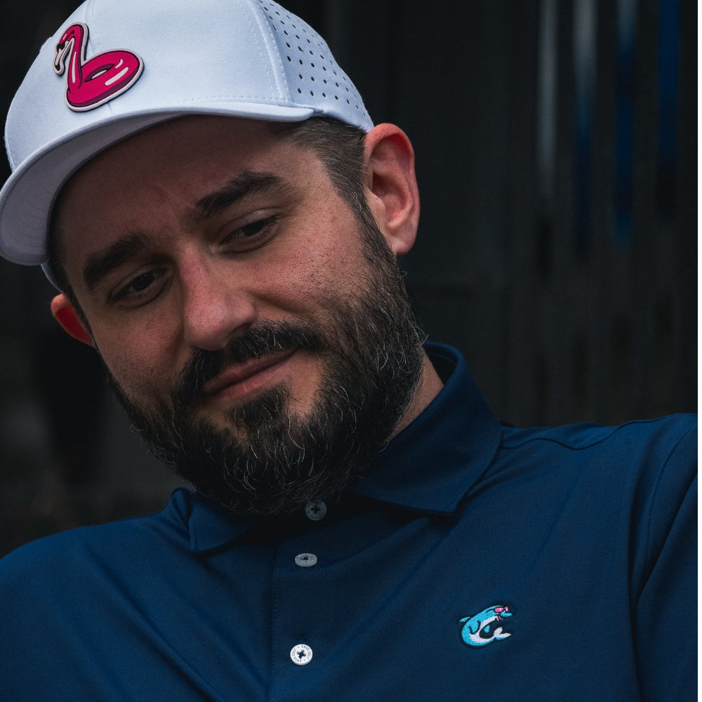 SWAG Golf Navy Flipper Classic Polo men's performance golf shirt with embroidered Flipper logo on chest