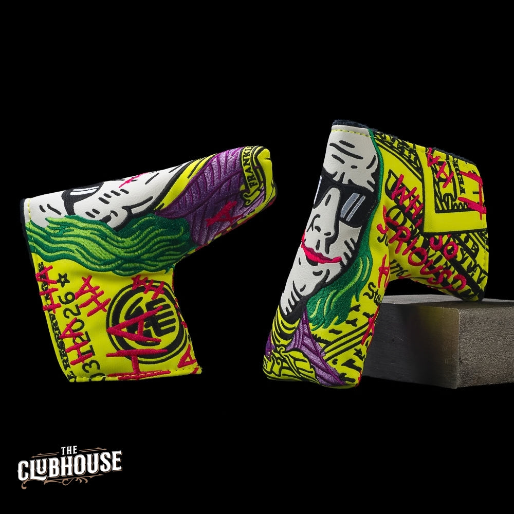 Two sides of SWAG Golf Neon Jumbo Defaced Franklin blade headcover with yellow bill art, green-haired portrait, and pink graffiti.