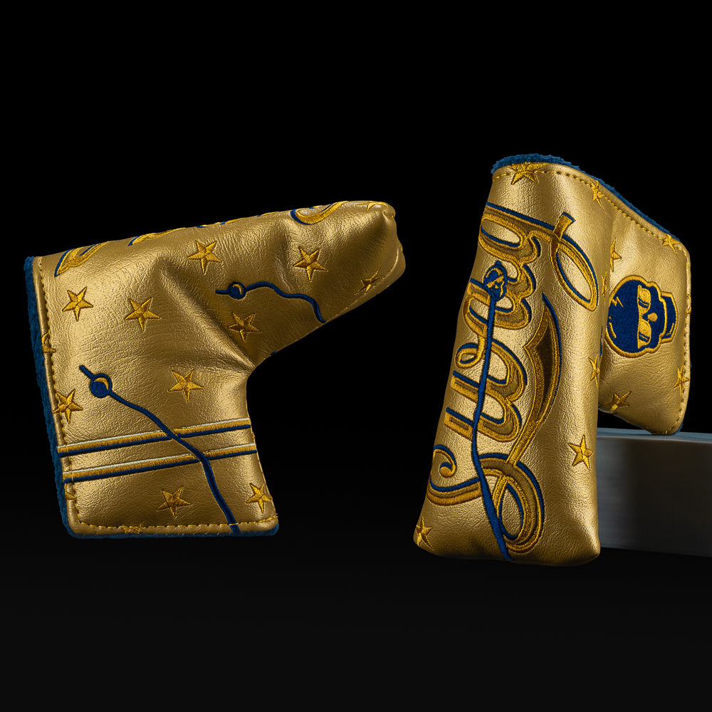 SWAG Golf Philly Freedom blade putter cover with metallic gold leather, navy embroidery, stars, and skull accents.