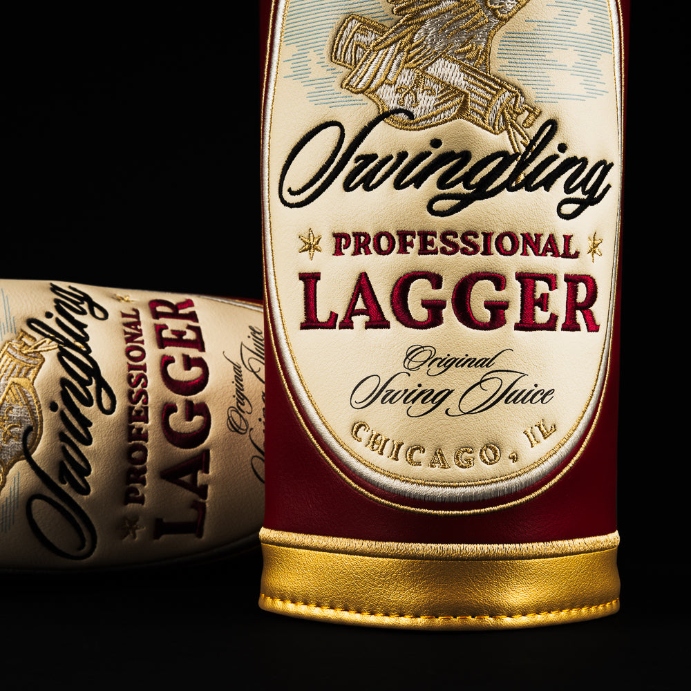 Swingling Lagger barrel fairway cover in burgundy with vintage beer label-inspired design and gold trim.