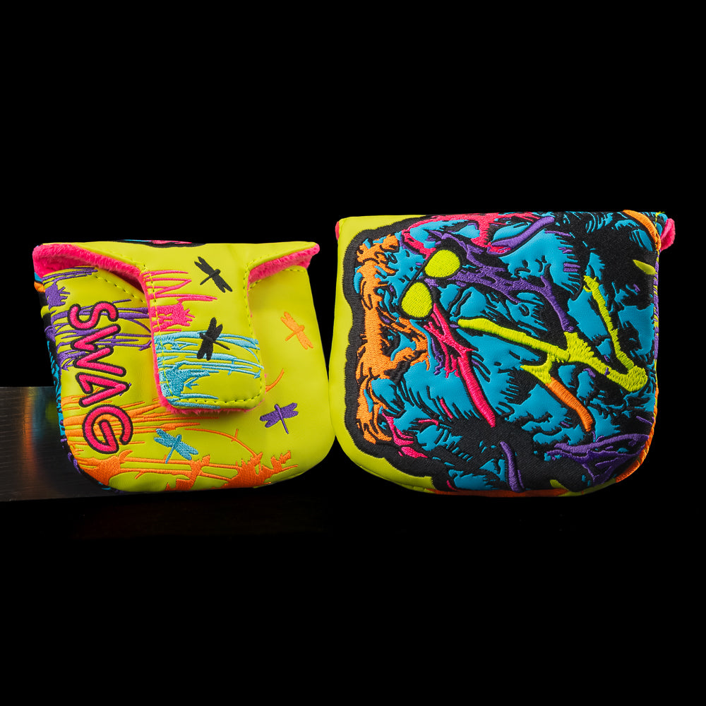 Bright yellow Swagthing mallet putter cover with colorful stitched creature, splatter graphics, and purple SWAG text.