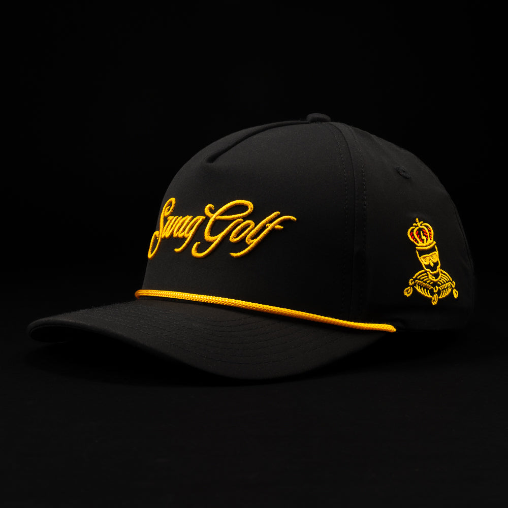 Black Swag Royal King golf hat with gold lettering.
