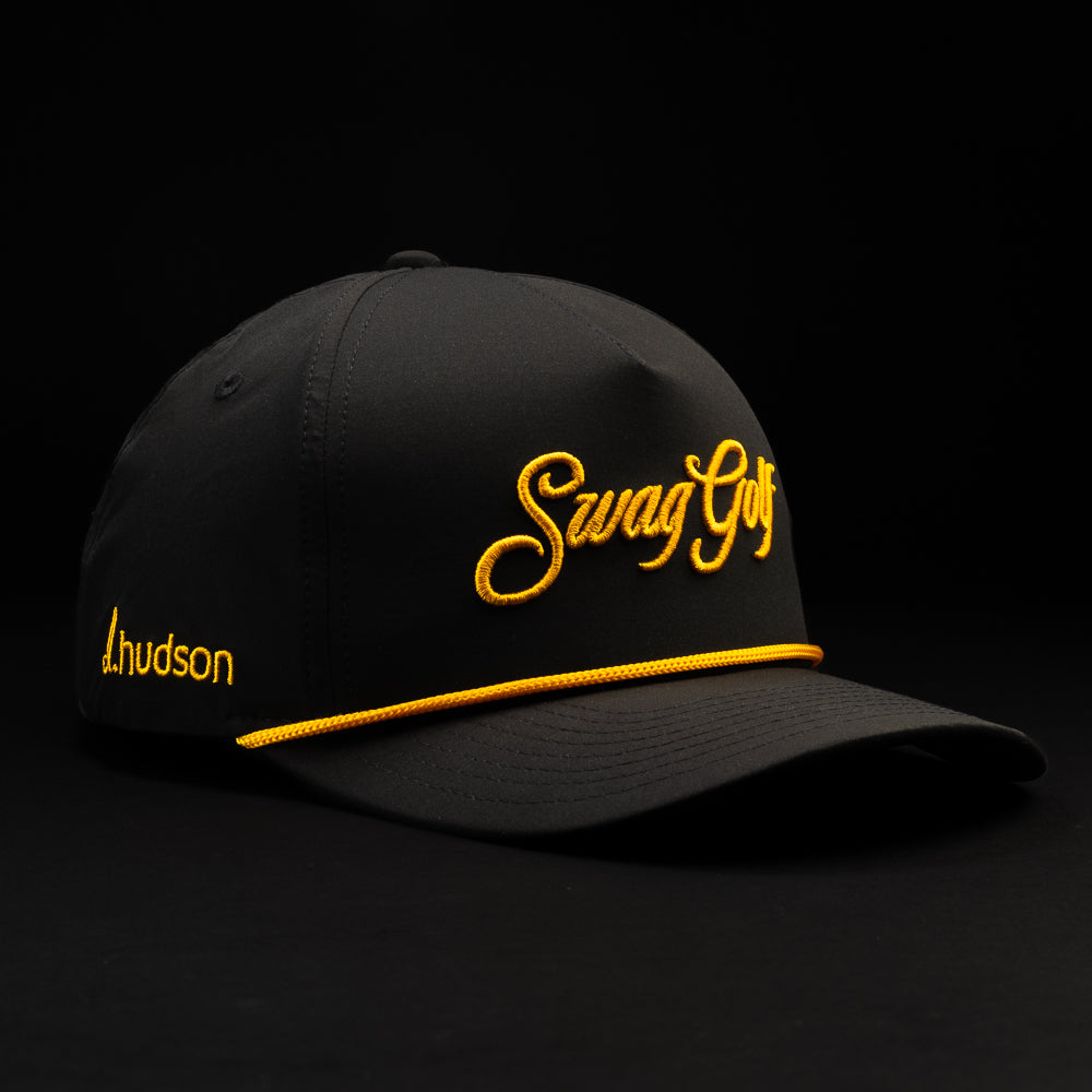 Black Swag Royal King golf hat with gold lettering.
