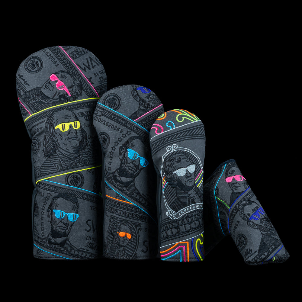 SWAG Golf Blackout Bills Blade Set showing driver, fairway, hybrid, and blade headcovers with dark dollar bill graphics and neon accents.