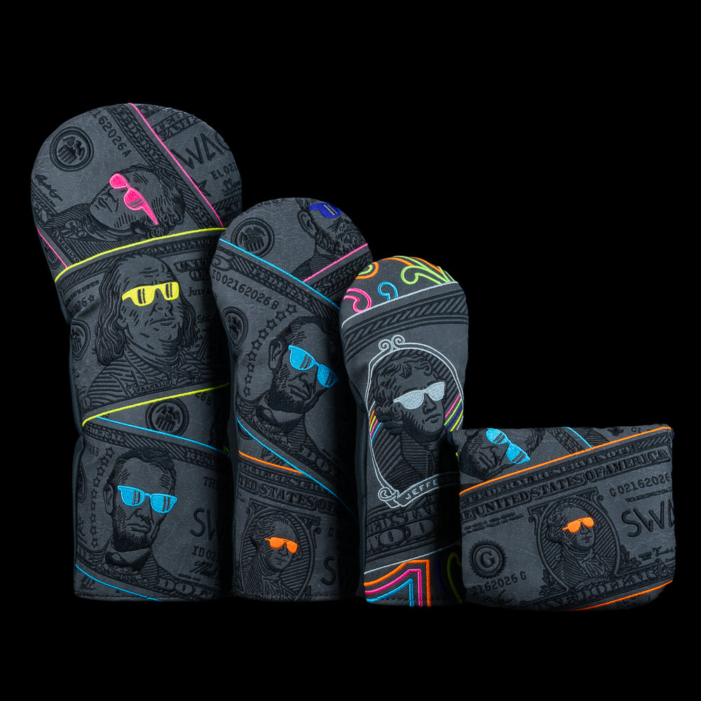SWAG Golf Blackout Bills Mallet Set showing driver, fairway, hybrid, and mallet covers with blackout dollar bill graphics, neon accents, and the founding fathers in shades.