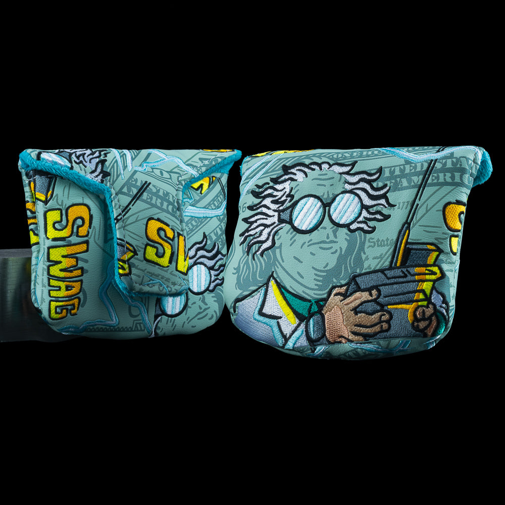 SWAG Golf Great Scott! Mallet Cover featuring mad scientist portrait with wild hair and goggles, electrified vandalized bill artwork, teal trim, and bold yellow SWAG embroidery.