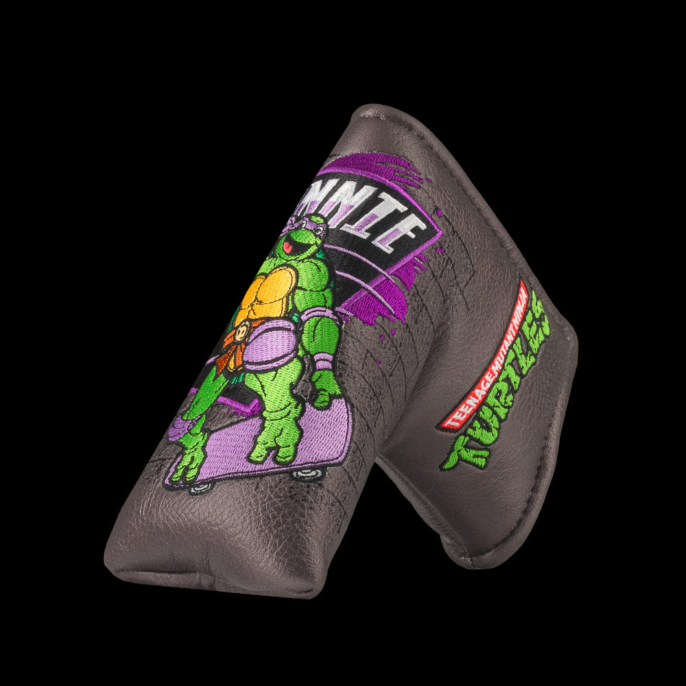 TMNT Donnie blade putter cover featuring bold purple and brick details. A classic Teenage Mutant Ninja Turtles Turtle Power style.