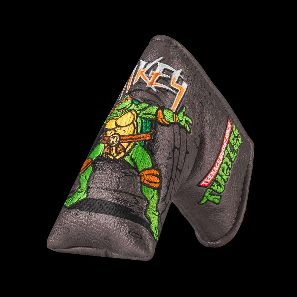 TMNT Mikey blade putter cover with neon green details, bold cartoon design, and Teenage Mutant Ninja Turtles style.