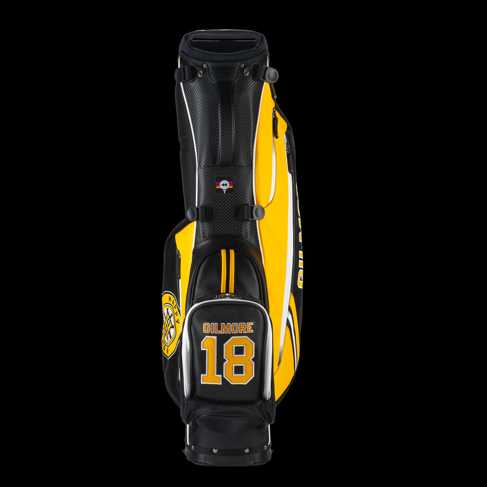 Yellow and black golf bag with 'Gilmore' branding on a white background