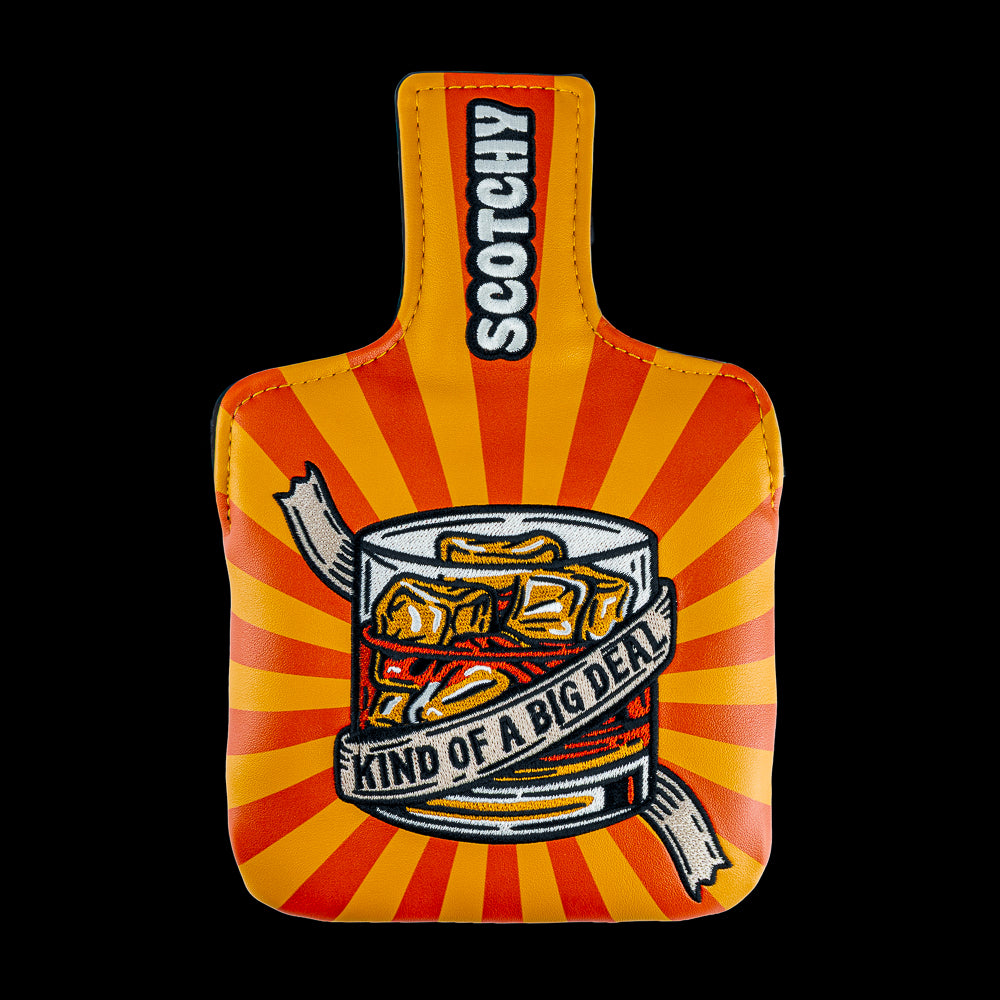 Rewind Golf x Anchorman mallet golf headcover with a graphic design of a glass of whiskey with 'Kind of a Big Deal' text on an orange and red striped UV material.