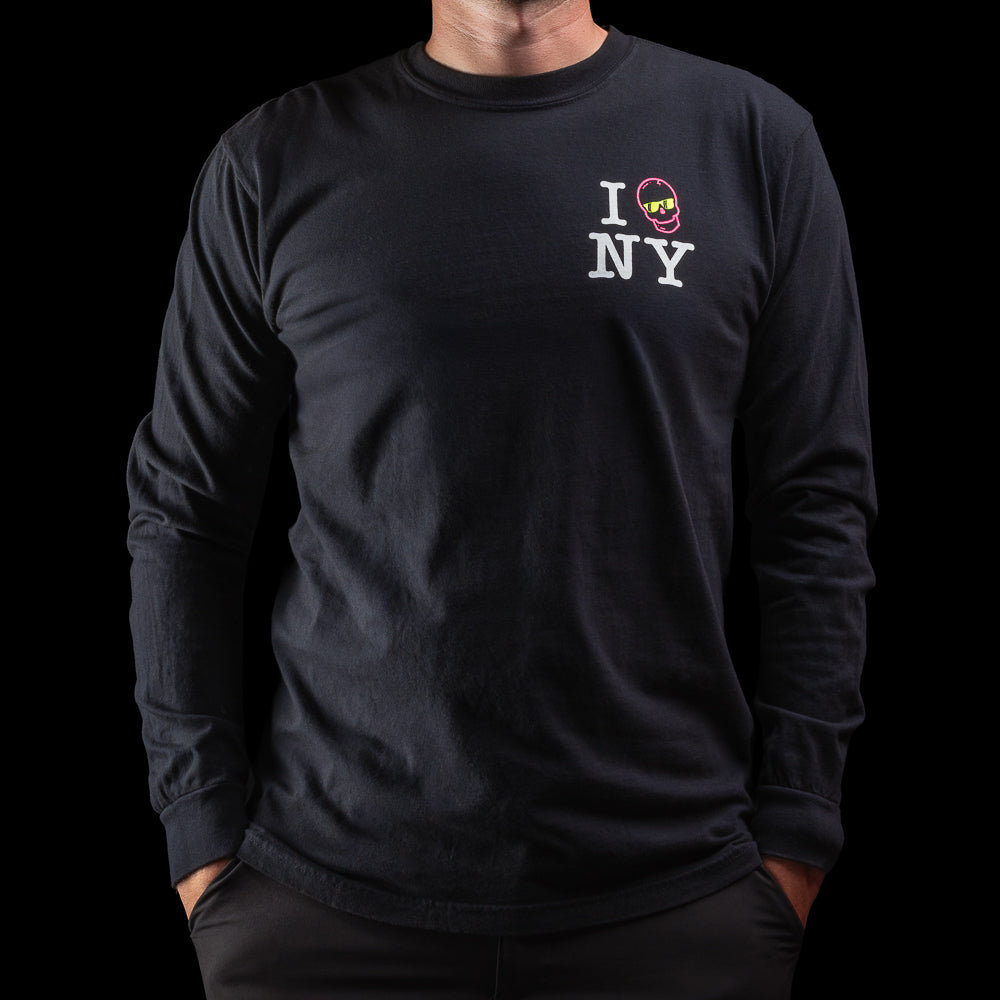 Person wearing a black long-sleeve t-shirt with 'I Skull NY' graphic design on a black background.