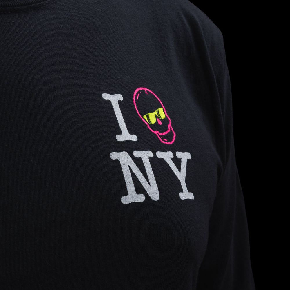 Person wearing a black long-sleeve t-shirt with 'I Skull NY' graphic design on a black background.