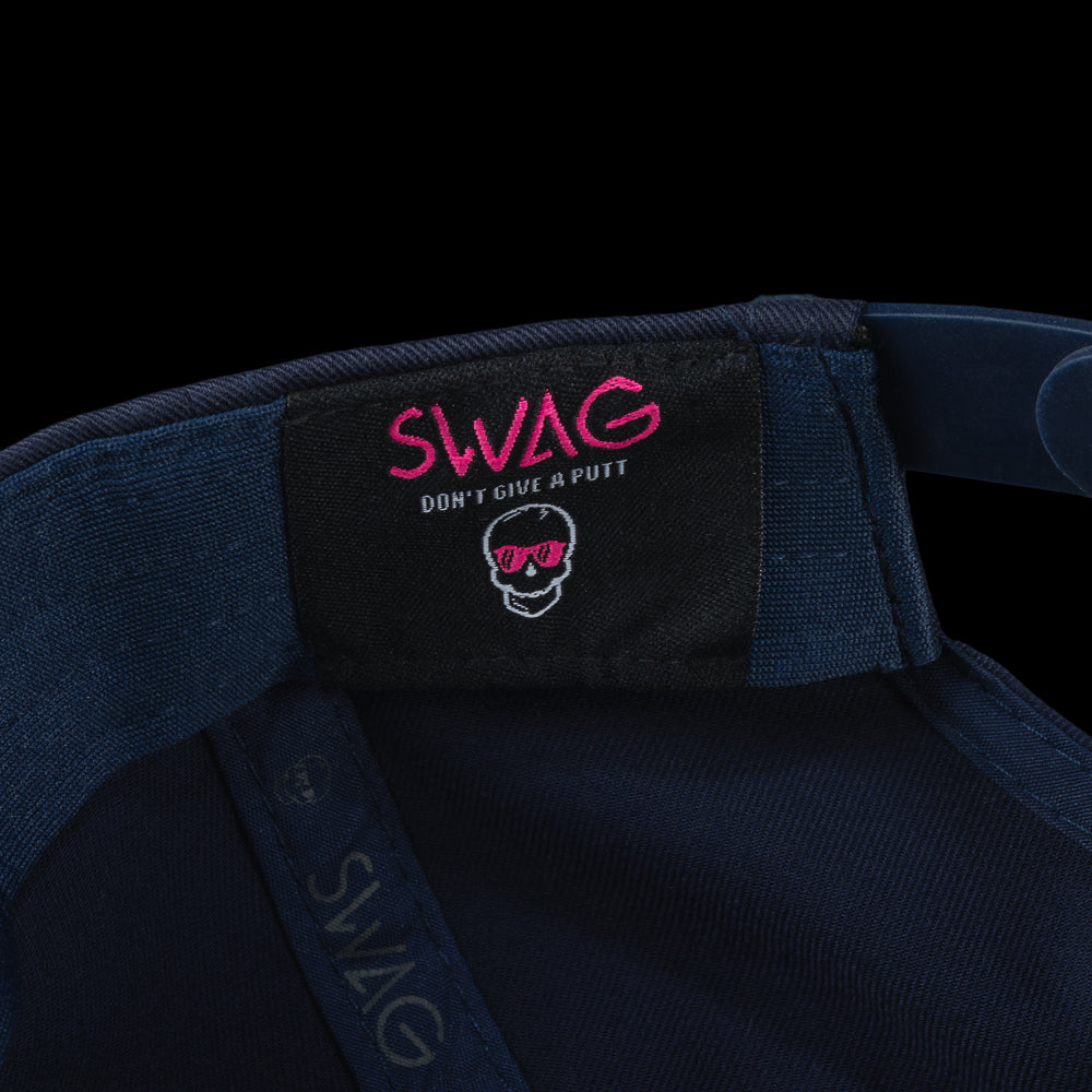 Navy blue cap with a colorful 'SWAG' patch featuring a cartoon character on a black background