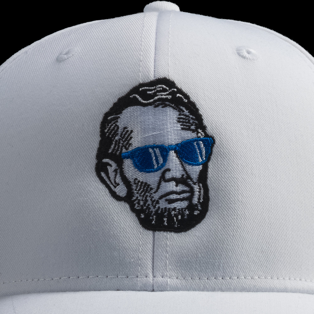 White SWAG Golf cap with a graphic of a Abe Lincoln wearing sunglasses on a black background
