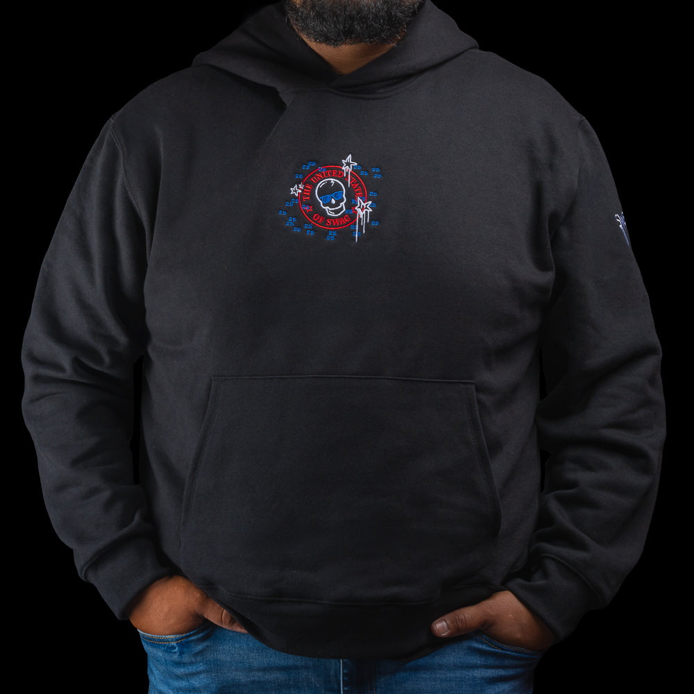 Person wearing a black hoodie with a colorful United States of SWAG graphic design.