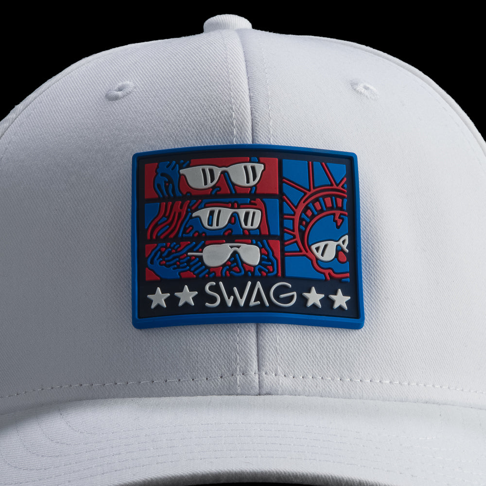 White cap with a colorful patch featuring sunglasses and the word 'SWAG' on a black background