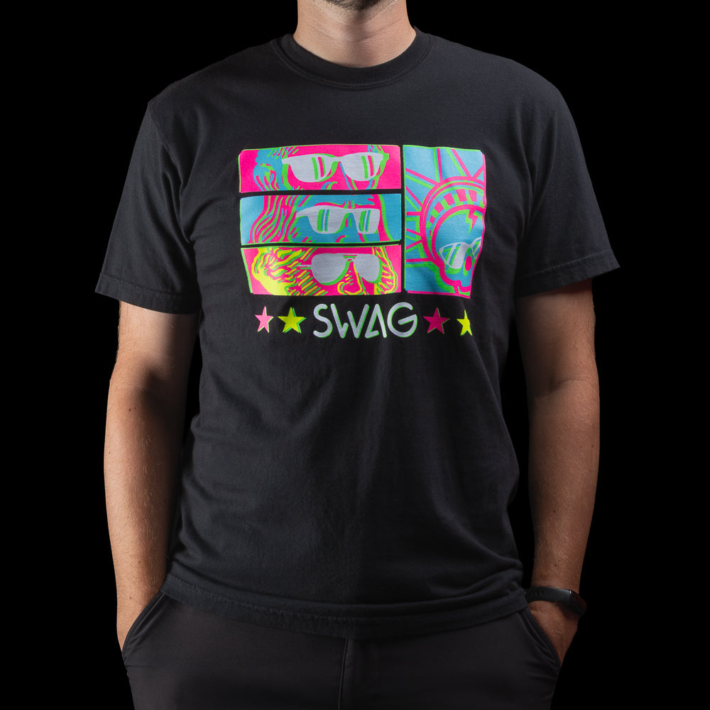 Person wearing a black t-shirt with colorful Peepers sunglasses graphic design and 'SWAG' text on a black background.
