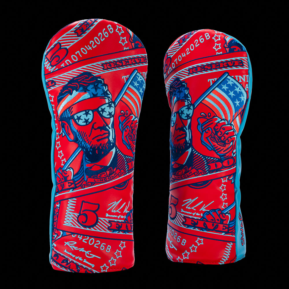 SWAG Golf Patriotic Abe driver cover featuring Abraham Lincoln wearing patriotic sunglasses and a headband with American flag and commemorative currency graphics on a red and blue design.