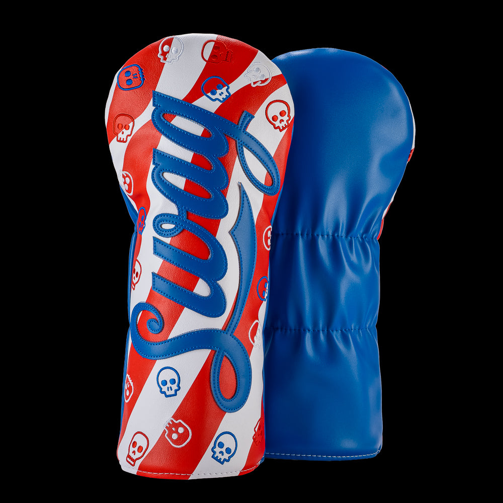 SWAG Golf USA SWAG Script driver cover featuring a large blue SWAG script logo over red and white stripes with red and blue skull graphics and a blue back panel.