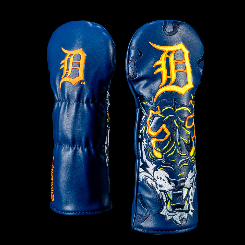 SWAG Golf Detroit Tigers fairway cover shown front and back with the classic Tigers logo on the back and a roaring tiger graphic outlined with glowing orange accents on deep navy.