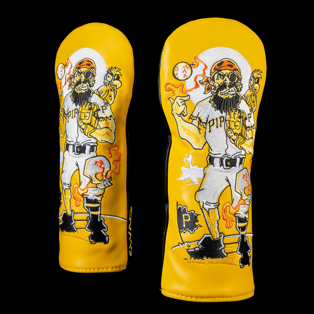 SWAG Golf Pittsburgh Pirates fairway cover featuring a pirate player with an eyepatch and beard, a smoking baseball, a shoulder parrot, glowing orange flames, a Pirates flag, and a full moon on a gold background.