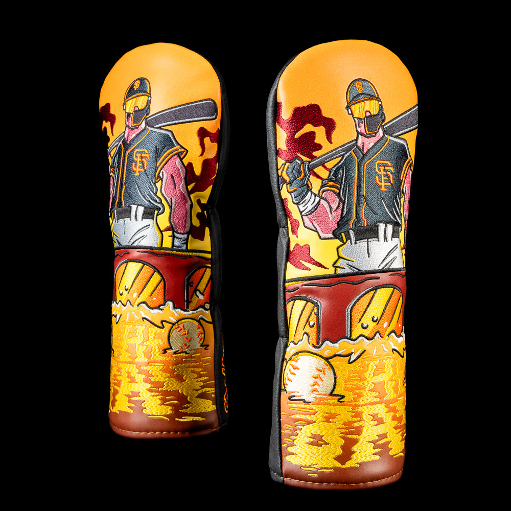 San Francisco Giants fairway cover featuring an armored batter with a bat over his shoulder overlooking McCovey Cove, the Bay Bridge, floating baseballs, and a golden-orange sunset in Giants colors.