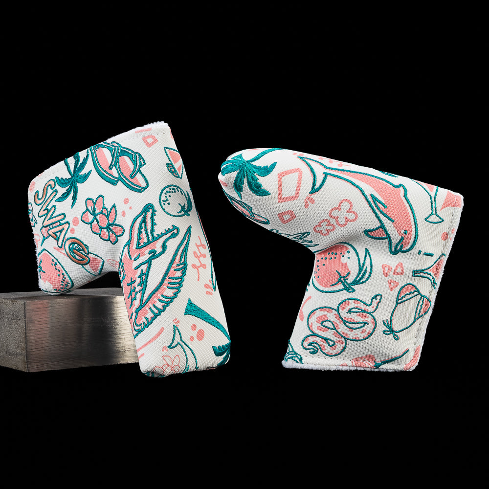 Florida blade putter cover featuring embroidered artwork of an alligator, dolphin, palm tree, oranges, tropical flowers, and Florida inspired icons with SWAG branding in teal and coral.
