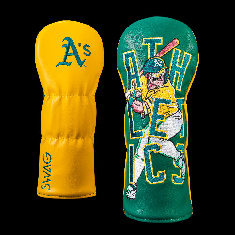 SWAG Golf Athletics fairway cover with an embroidered Athletics logo on the reverse and bold artwork featuring a batter swinging in front of oversized ATHLETICS lettering in green and gold.