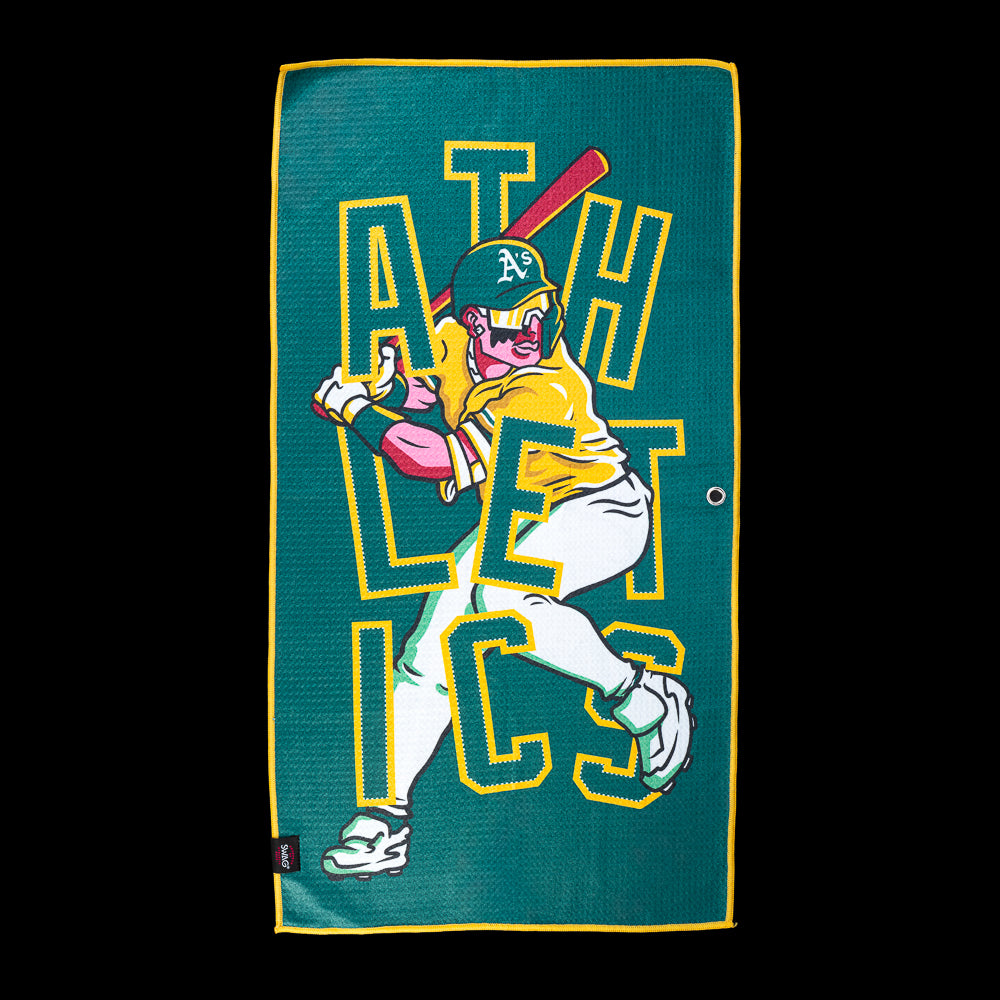 Athletics batter swinging through oversized green and gold "ATHLETICS" lettering on an officially licensed Las Vegas Athletics MLB golf towel by SWAG Golf.