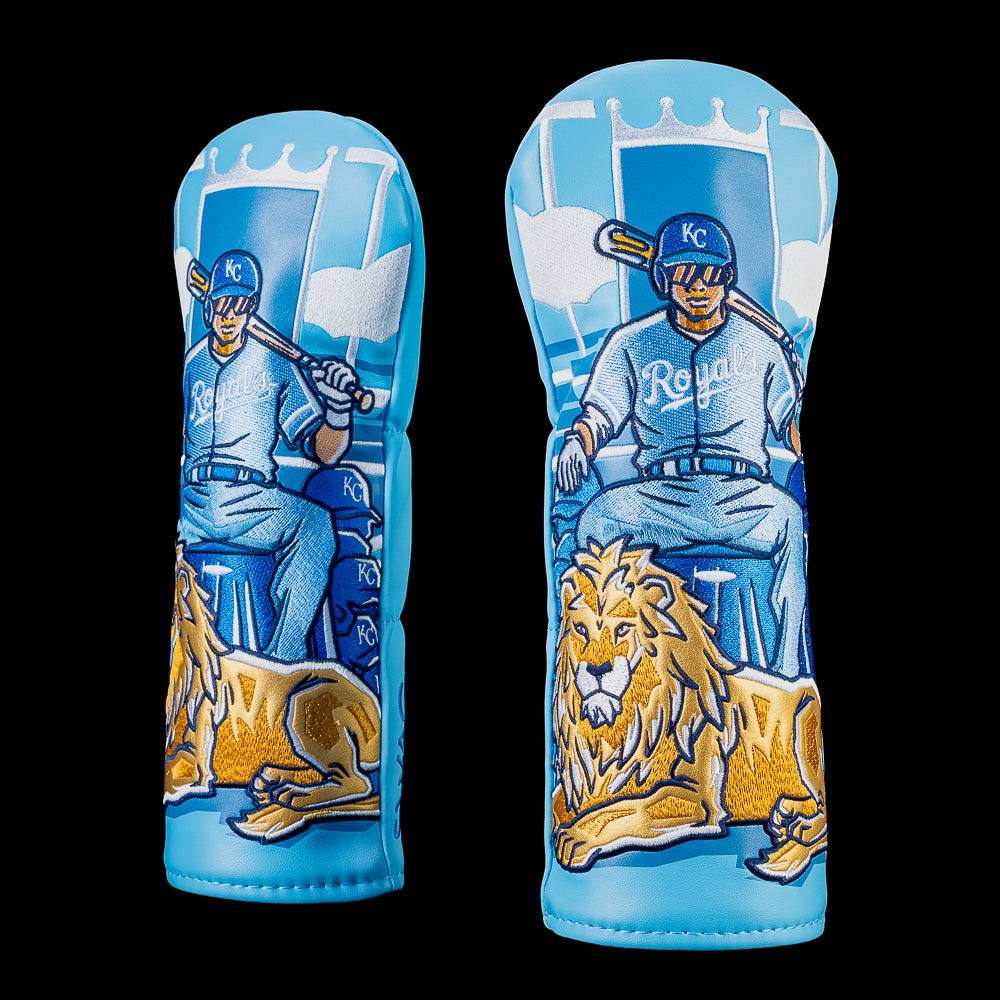 Kansas City Royals fairway cover featuring a Royals player seated on a throne with a lion at his feet beneath a royal crown backdrop in light blue and gold, officially licensed MLB cover by SWAG Golf.
