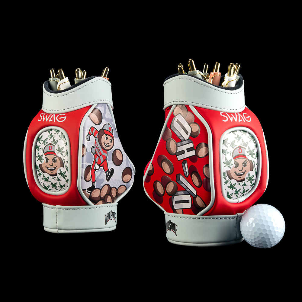 SWAG Golf Ohio State Buckeyes Desk Caddy in scarlet, gray, and white with illustrated buckeye nuts, a smiling buckeye character, repeating character portraits, and white panels filled with gray line art.