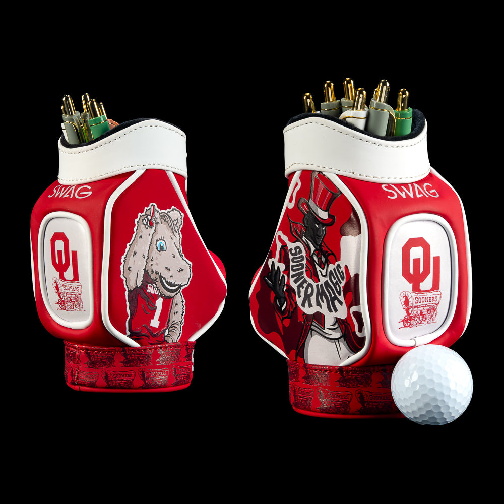SWAG Golf Oklahoma Sooners Desk Caddy featuring crimson, white, and black artwork, OU logos, bold Oklahoma lettering, and illustrated graphics.