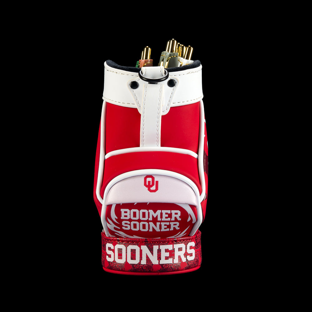 Front view of SWAG Golf Oklahoma Sooners Desk Caddy featuring crimson and white panels, Oklahoma branding, bold lettering, and graphic details.