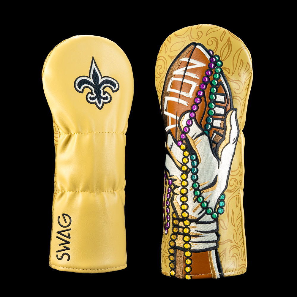 SWAG Golf NFL New Orleans Saints We Are NOLA Fairway Cover with gloved hand holding a football, Mardi Gras beads and ornate gold artwork.