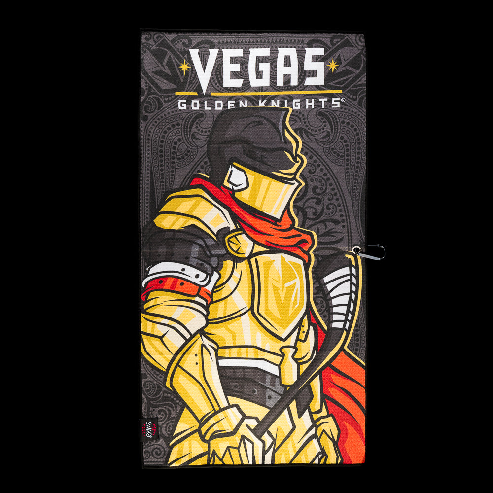 Black Vegas Golden Knights golf towel with a gold armored knight, hockey stick, red cape and Vegas Golden Knights logo.