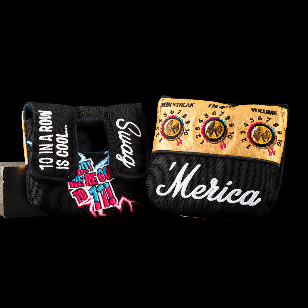 USA Goes to 11 small center shaft mallet cover featuring gold amplifier controls, neon lightning bolts, "'Merica" white script, and a black finish.